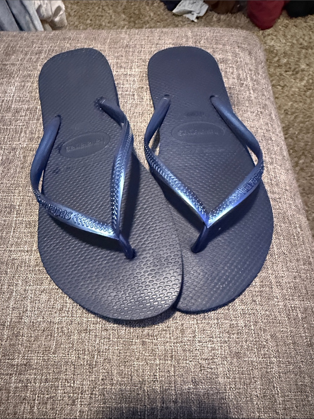 Woman’s navy blue havaianas flip flops